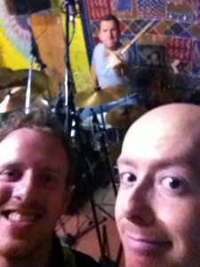 Derek, Greg and Stu lark around in the room during final writing sessions. 