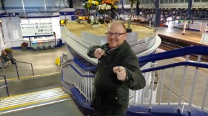 Byrne poses in front of the strange decorations at Stirling station.