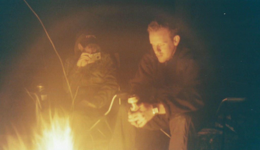 Night has fallen; Greg reflects. Stu takes pictures